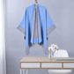Blue cape hanging in office with flower